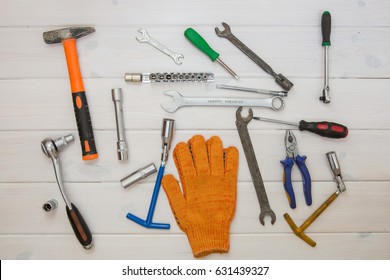 Garage tool set on a white colored wooden background