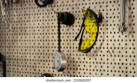 Garage Tools Hanging On The Wall. Professional Workshop Scene, Mechanic Garage Repair Service.