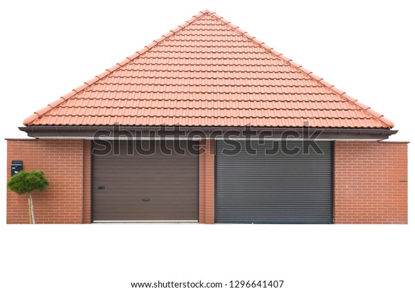 Garage\
for two cars of red brick, the roof of red tiles. The tree grows in\
front of the garage. Isolated on white\
background