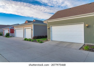 Garages exterior with sectional white garage doors at Daybreak, Utah
