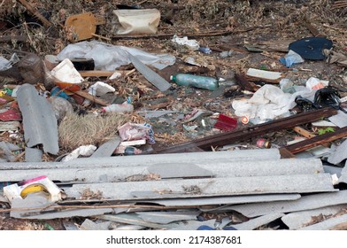 Garbage Being Dumped And Stored In A Vacant Downtown Residential Lot, Raising Issues Of City Waste Management And Public Health