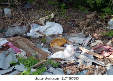 Garbage Being Dumped And Stored In A Vacant Downtown Residential Lot, Raising Issues Of City Waste Management And Public Health