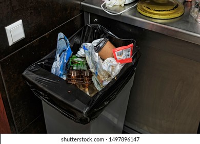 Garbage Bin Filled With Garbage In The Restaurant's Kitchen