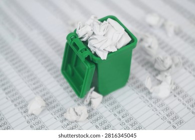Garbage bin on financial documents. Сleaning city of garbage management.	