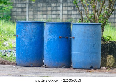 Garbage Bins Provided By The Local Council In A Suburban Courtyard.