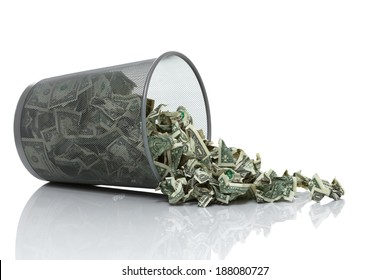 Garbage can full of money tipped on its side with money spilling out