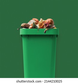 Garbage can full of organic waste, recycling and separate waste collection concept - Shutterstock ID 2144210025
