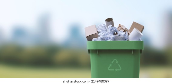 Garbage can full of paper waste, recycling and separate waste collection concept - Shutterstock ID 2149480397