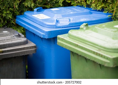 Garbage cans in different colors symbolizing recycling in Germany