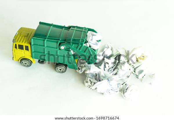 Garbage collection truck car for clean paper waste\
on white floor