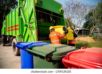 Garbage collector Worker of urban municipal recycling garbage collector truck loading waste and trash bin
