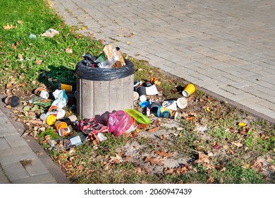 Garbage Container. Garbage Can. Rubbish Is Scattered Around The Trash Can On The Street. Waste Recycling Concept In The City. Selective Focus. 