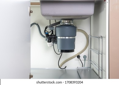 Garbage Disposal under the modern sink, waste chopper concept - Shutterstock ID 1708393204