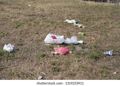 Garbage dump on the grass - ecology concept.