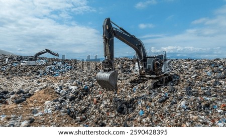 Garbage dump pile in trash dump or landfill, Landfill with waste disposal, Garbage truck unloads rubbish in landfill, Truck waste dump waste from household, Excavator work garbage waste, Aerial view.