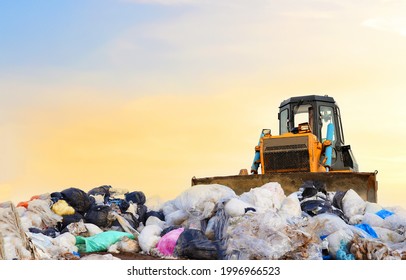 Garbage Dump With Plastic Bags And Food Waste. Recycling Of Construction Waste On Junk Yard. Refuse Collection. Bulldozer Dispose Of Rubbish At A Landfill. Trash Disposal Area. Dozer On Rubbish Dump