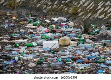 Garbage Dump In The River- Danube. Water Polution. Plastic And Other Residues. Lots Of Plastic Bottles Thrown Into The Water. Romania, Orsova. January, 19, 2020