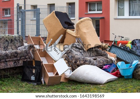 garbage dump with used broken furniture.