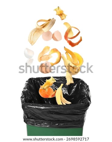 Garbage falling into trash bin on white background. Waste sorting