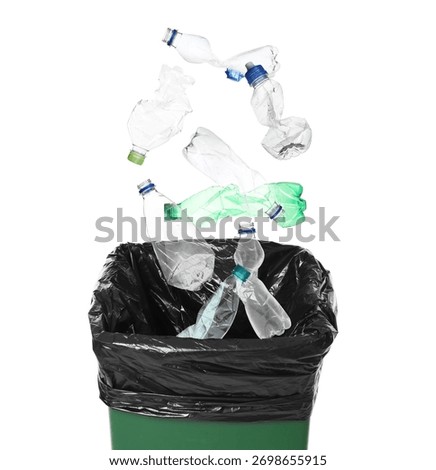 Garbage falling into trash bin on white background. Waste sorting