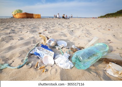 Garbage On A Beach Left By Tourist, Environmental Pollution Concept Picture, Baltic Sea Coast, Poland.