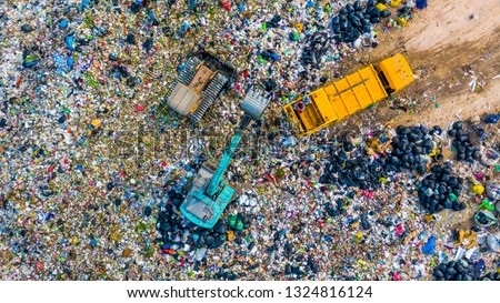 Garbage pile in trash dump or junkyard, Aerial view garbage metal truck unload garbage consumption junkyard scarp, Global warming, Ecosystem and healthy environment concepts and background.