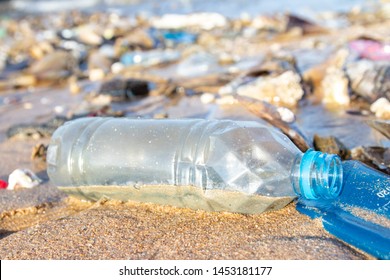 Garbage And Plastic Bottles Polution On The Beach