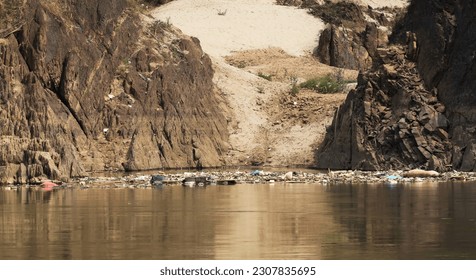 Garbage, plastic and debris floating downstream on the Mekong river between Huay Xay and Pak Beng, Laos.