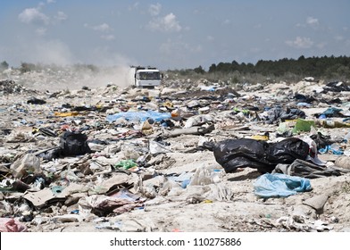 Garbage Truck Comes In The Landfill, Focus On Plastic Bags