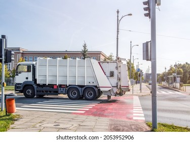 Garbage Truck At The Intersection Of The City Road