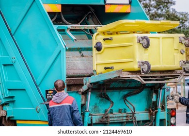 A Garbage Truck Picks Up Garbage In A Residential Area. Separate Collection And Disposal Of Garbage. Garbage Collection Vehicle