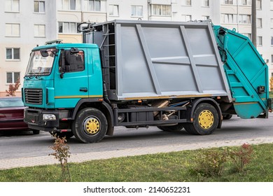 A Garbage Truck Picks Up Garbage In A Residential Area. Separate Collection And Disposal Of Garbage. Garbage Collection Vehicle