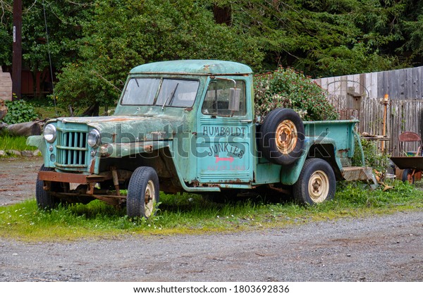 Garberville, United States - February 15 2020:\
an old rustic and classic pick up truck along the road is used as\
advertisement\
billboard