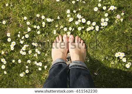 Similar – Image, Stock Photo bare feet on green meadow with white and yellow flowers