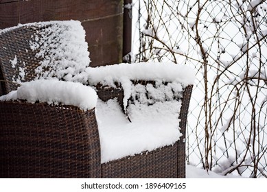 Garden Armchair Covered With A Layer Of Snow. Garden Furniture In Winter.