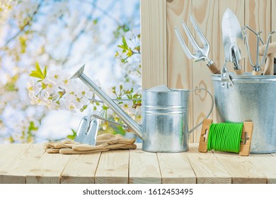 Garden Articles On Wooden Table In Garden