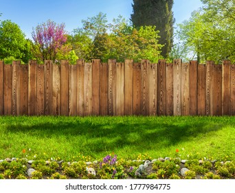 Garden Backyard With Grass Lawn And Flower Bed