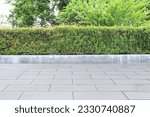 Garden, beautifully trimmed shrubs gray tile floor Multipurpose yard Suitable for a walk or picnic.