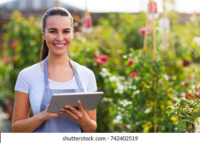 Garden Center Worker Using Digital Tablet
