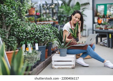 Garden Center Worker Using Laptop
