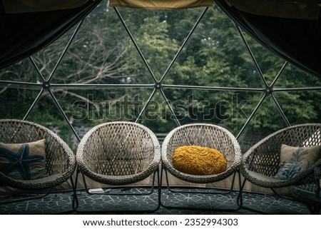Garden chairs inside glamping dome, Llanfairfechan, North Wales, Cymru, UK