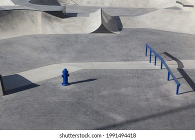 Garden Design And Landscaping: New Built Modern Skate Park With Various Lanes, Bowls, Transitions And Obstacles. Close Up, Texture, Background
