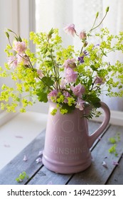 Garden flowers bouquet on wooden background - Shutterstock ID 1494223991