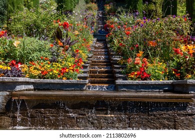 Garden With Flowers On The Slope Below Is A Waterfall