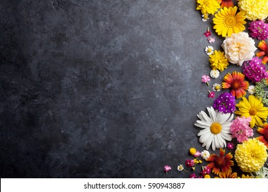 Garden Flowers Over Stone Table Background. Backdrop With Copy Space