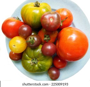 Garden Fresh Collection Of Heirloom Tomatoes Of Different Sizes On Blue Plate And White Background