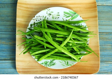 garden fresh indian vegetable green cluster beans or guar beans in dish also known in india as guwar,guvar bean,guar bean  