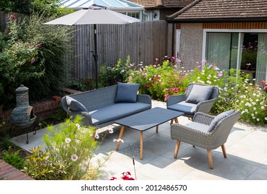 Garden furniture on the terrace on sunny day - Shutterstock ID 2012486570