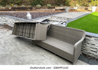 Garden Furniture Overturned By The Strong Winds Of An Overnight Storm. No People.