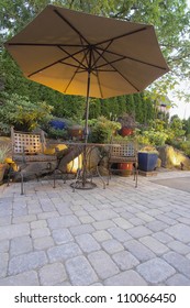 Garden Furniture Table Chairs And Umbrella On Pavers Patio